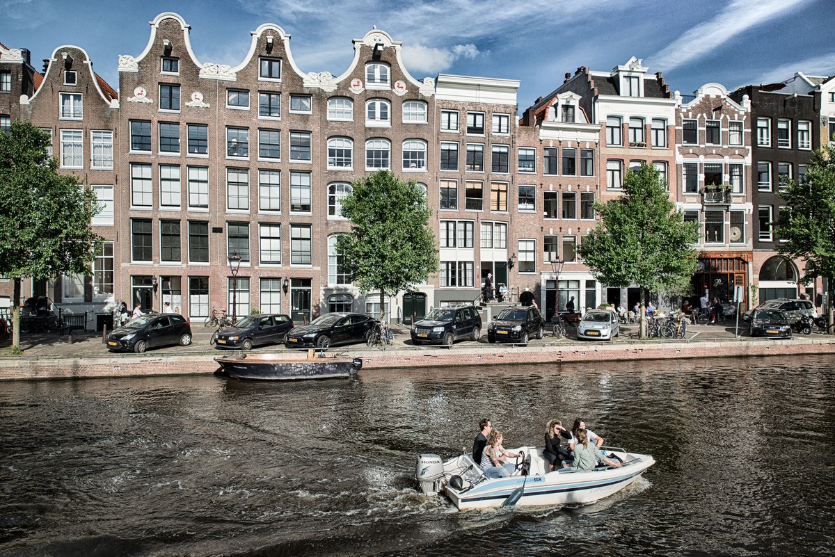 Motor boat moving on an Amsterdam canal