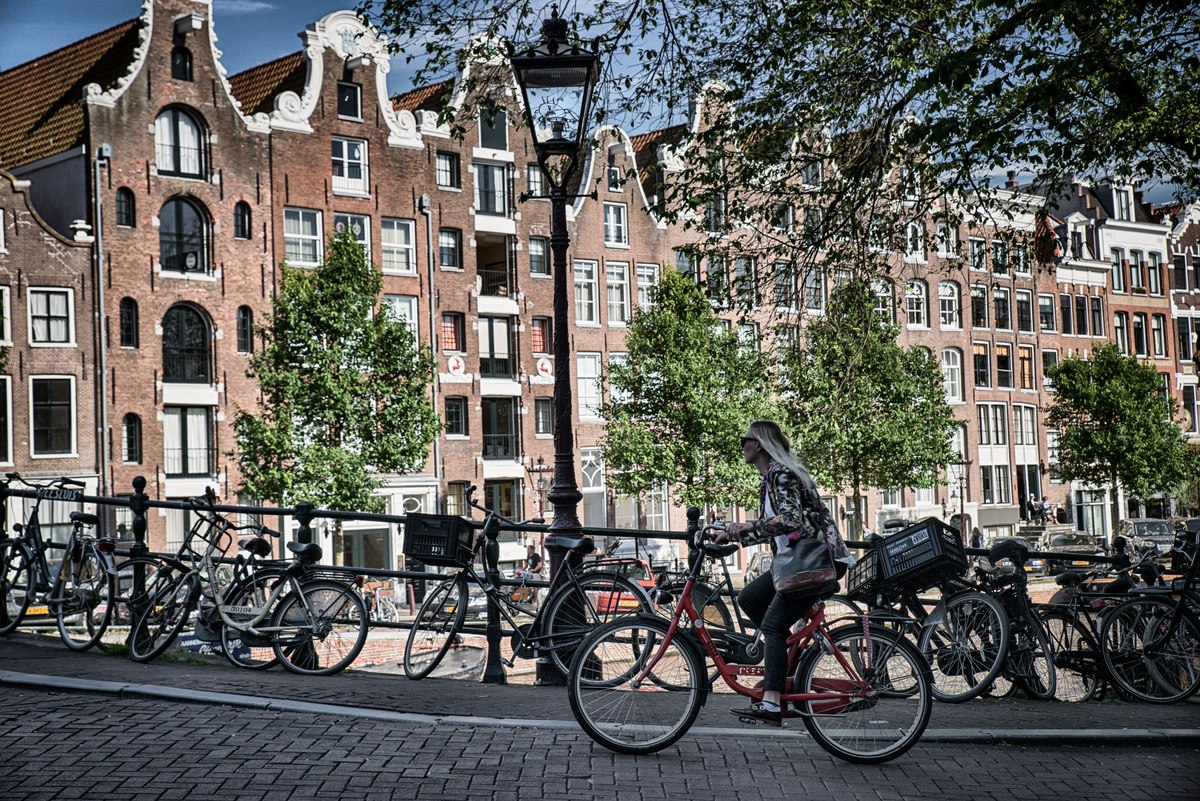 Woman riding bike in Amsterdam