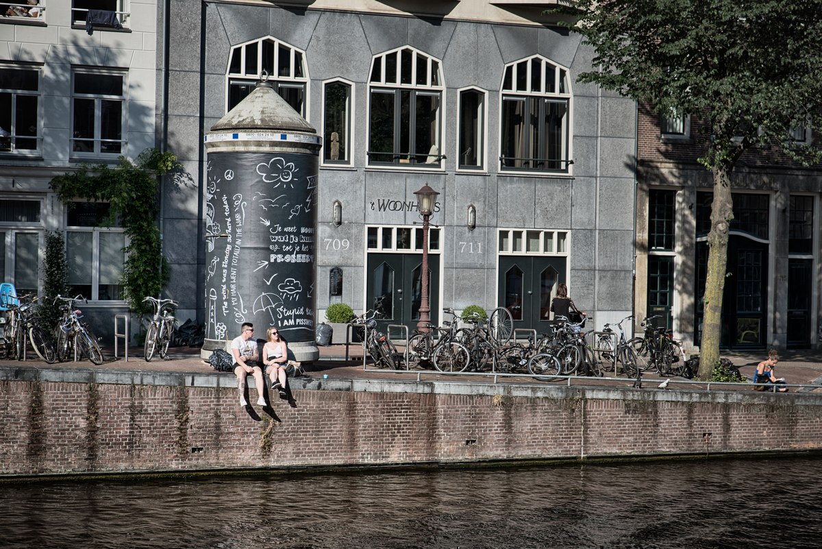 Relax on Amstel bank in Amsterdam