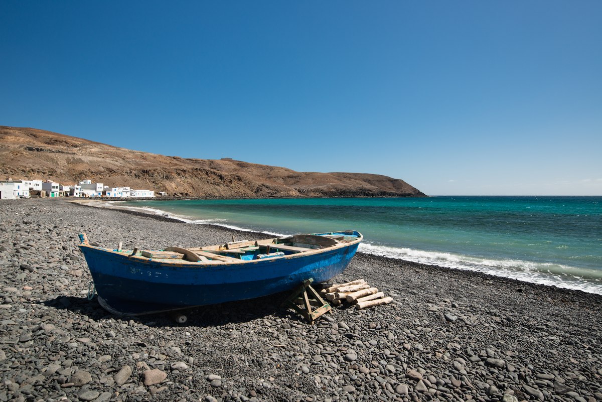 Blue boat on beach