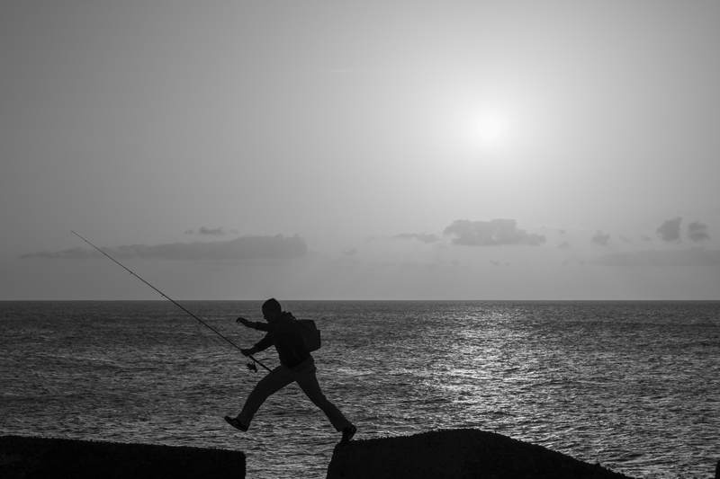 Fisherman jumping